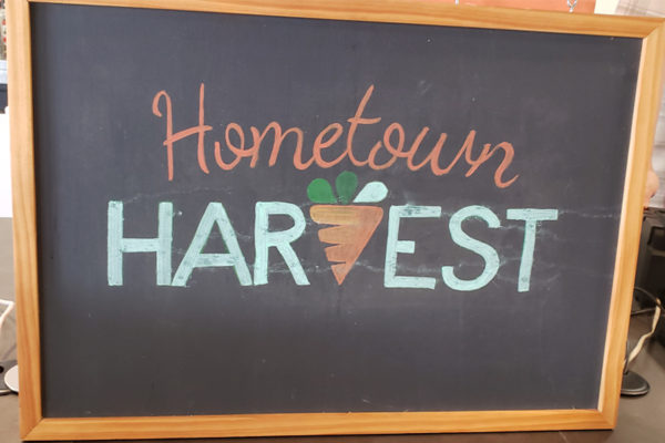 Graphic Design Project: Hometown Harvest original logo, on chalkboard